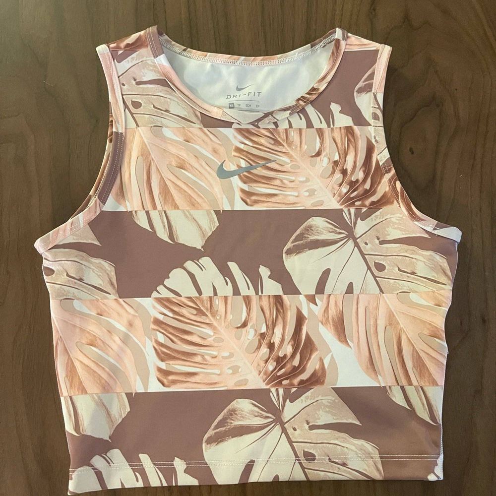 Nike tank top, size XS, colors include pink, white, and brown